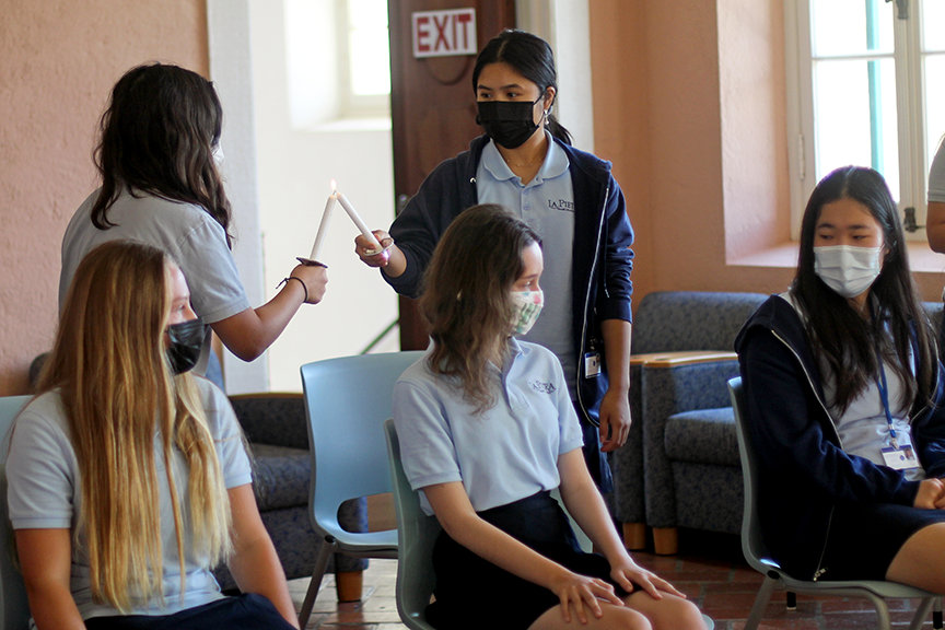 Current HNS members continue the ceremonial lighting of candles during induction day.