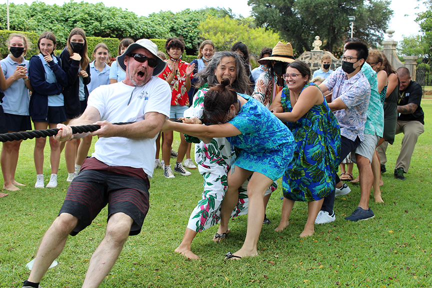 Faculty take on the seniors in tug of war.