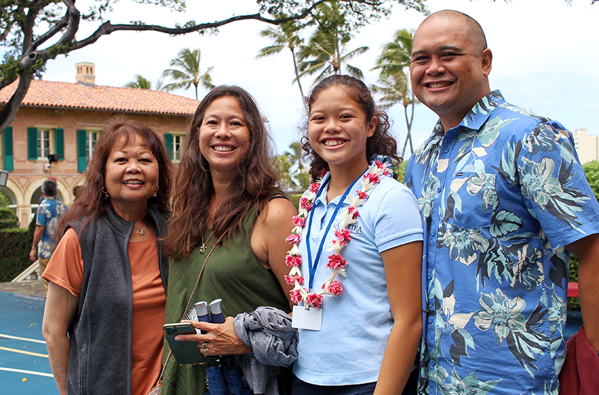 Olivia Butterfly R. and family after receiving the Highest Academic Standing award for the freshmen class.