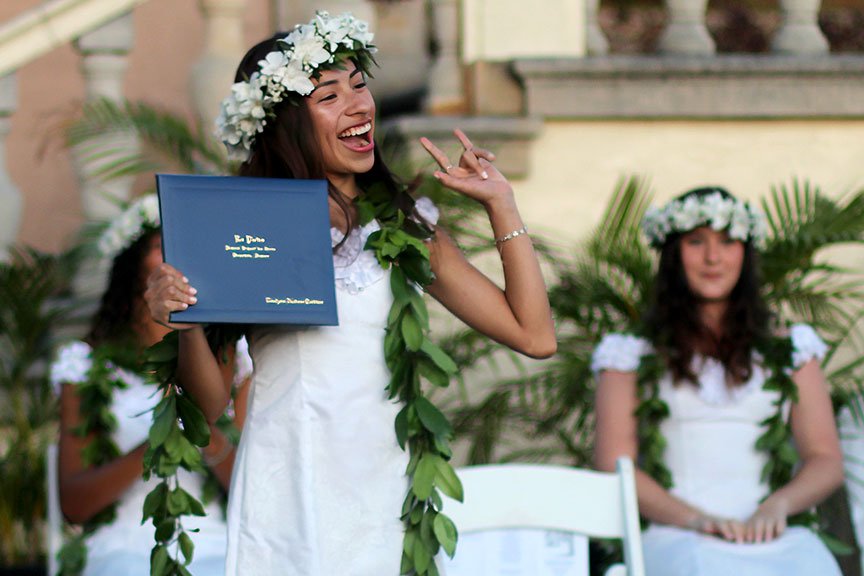 Evalynn T. receives her diploma. 