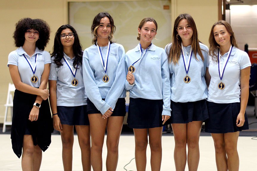 Three-sport athletes awarded during a co-curr assembly.